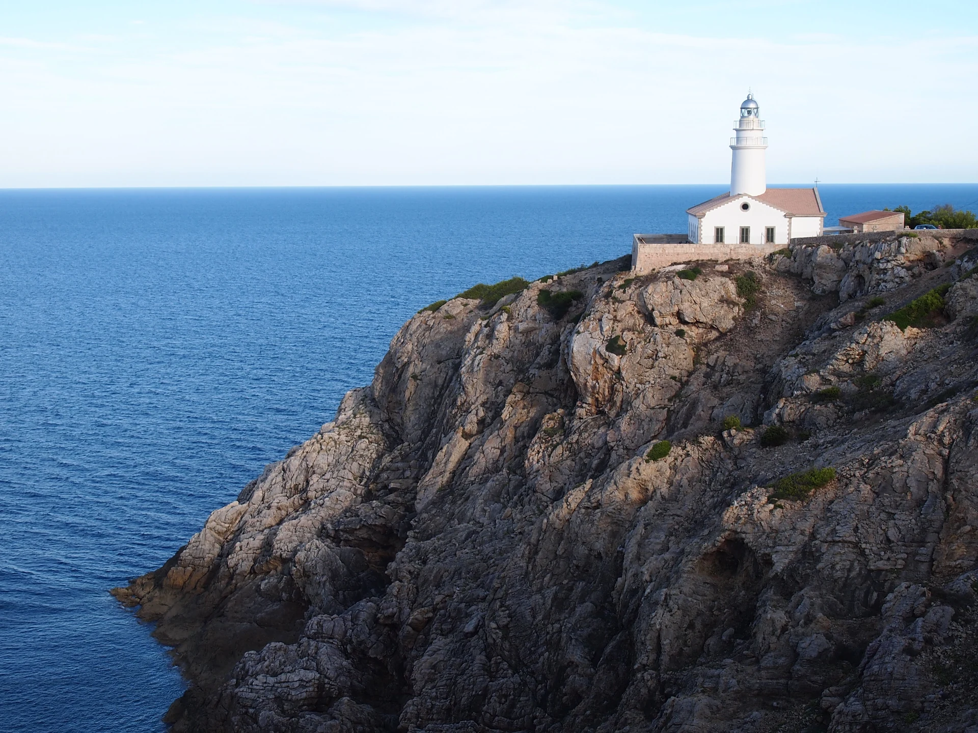 Formentor lighthouse above the cliffs and Mediterranean Sea, Mallorca